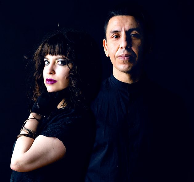 Duo in darkwave posture and lighting