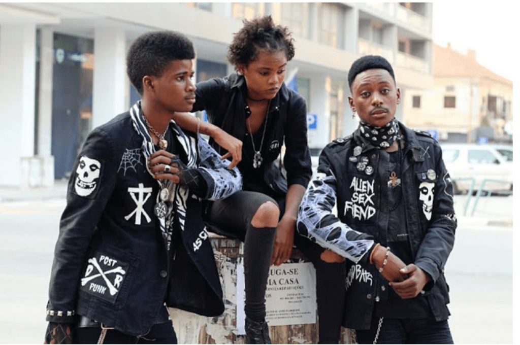 Black youths styled punk-goth on urban street