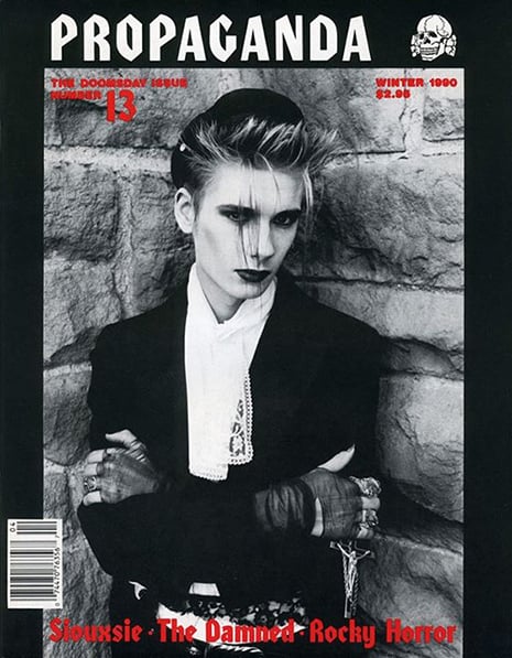 Cover of Propaganda magazine featuring a stylized male-presenting goth model with dramatic makeup and structured fashion, representing editorial masculine expression in goth culture